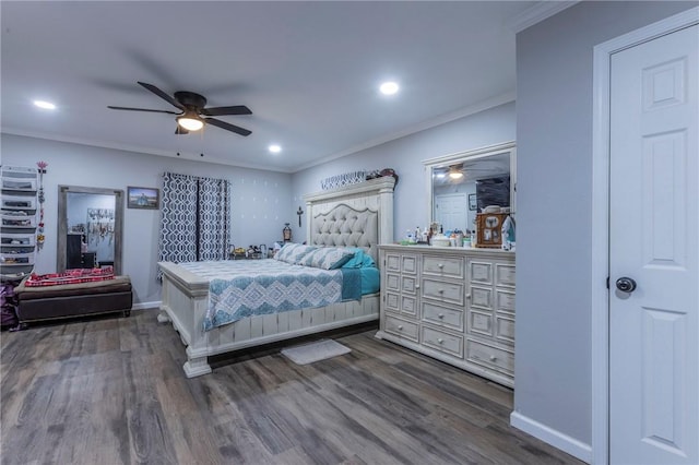 bedroom with ceiling fan, dark hardwood / wood-style flooring, and ornamental molding