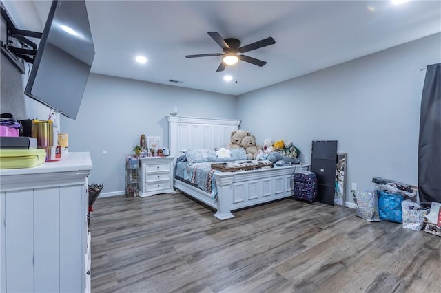 bedroom featuring wood-type flooring and ceiling fan