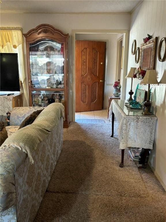 interior space with crown molding and light colored carpet