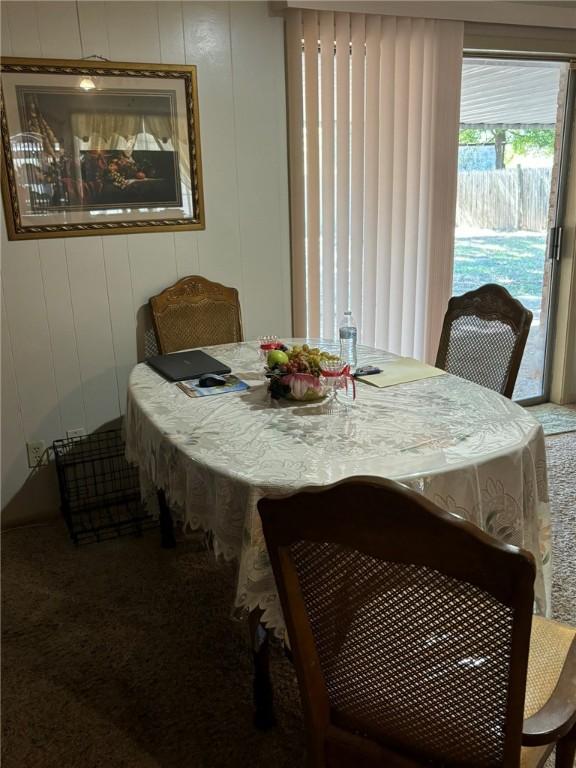 dining space featuring carpet flooring