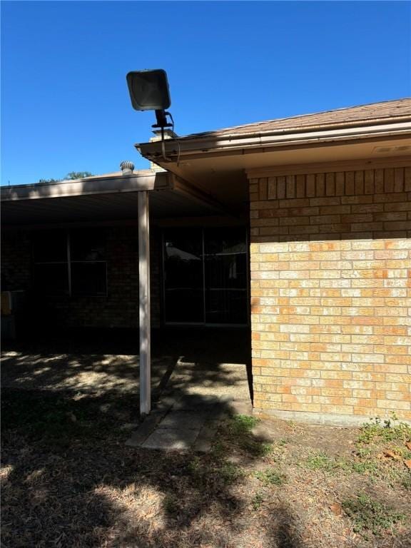 exterior space with a carport