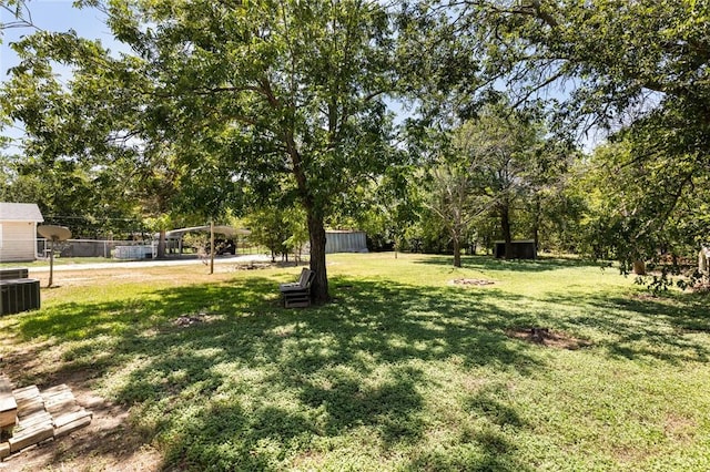 view of yard featuring central AC unit