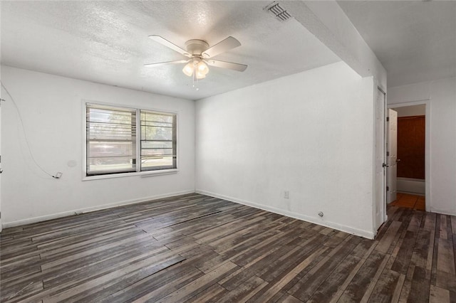 unfurnished room with ceiling fan, dark hardwood / wood-style flooring, and a textured ceiling