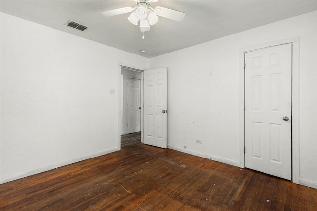 unfurnished bedroom with dark hardwood / wood-style floors and ceiling fan