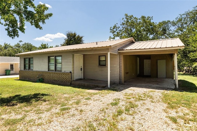 single story home with a carport and a front yard