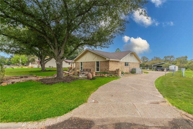 ranch-style home featuring a front yard and a carport