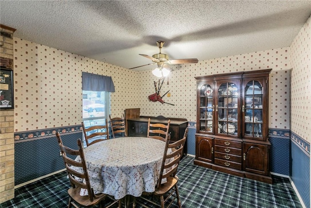 dining room featuring a textured ceiling and ceiling fan