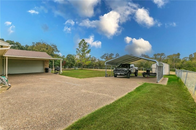 view of parking / parking lot featuring a yard and a carport