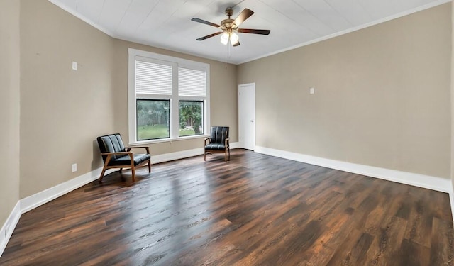 living area featuring dark hardwood / wood-style floors, ceiling fan, and ornamental molding