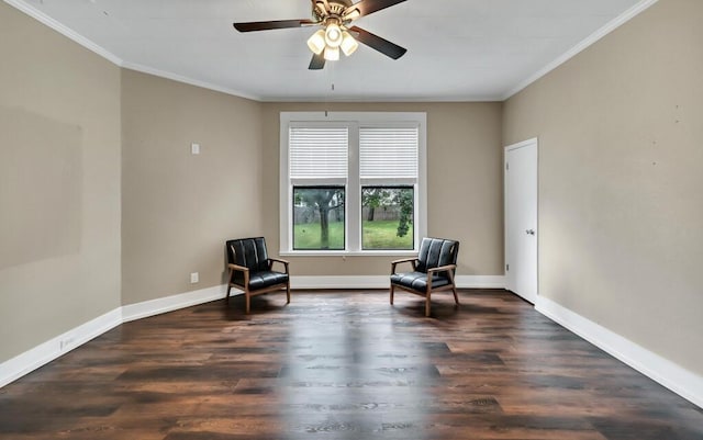 living area with ceiling fan, dark hardwood / wood-style flooring, and ornamental molding