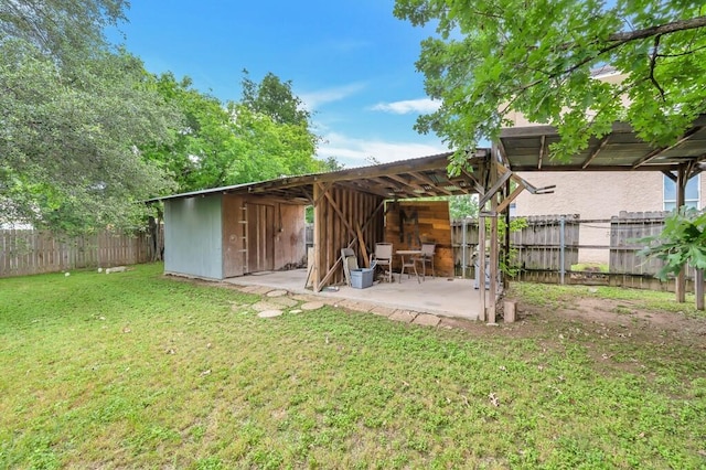 exterior space featuring a lawn and an outdoor structure