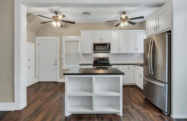 laundry room with washer and dryer and dark hardwood / wood-style flooring