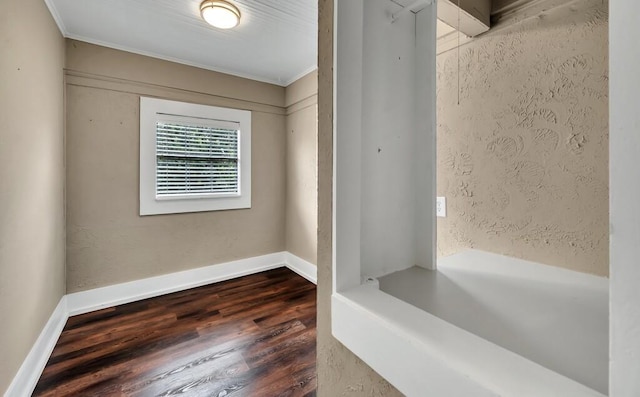 bathroom featuring crown molding and hardwood / wood-style flooring