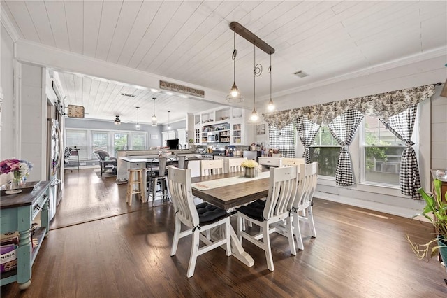 dining area with wood ceiling, ceiling fan, crown molding, and dark wood-type flooring