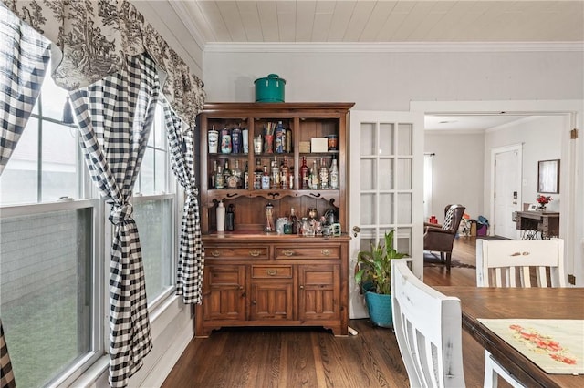 interior space with dark wood-type flooring and ornamental molding