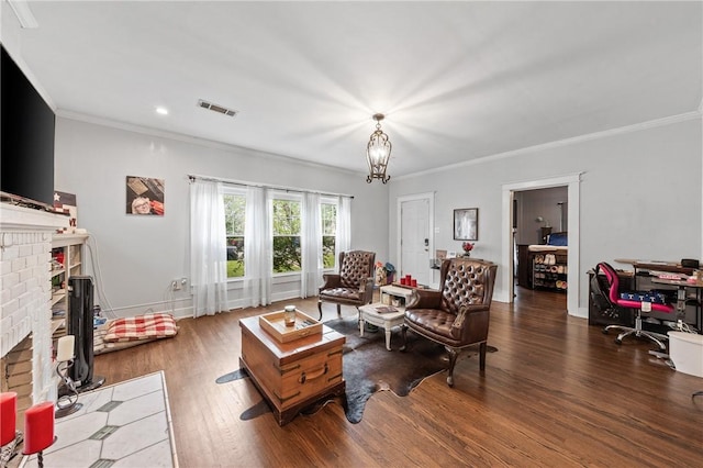 living room featuring ornamental molding, a fireplace, and dark wood-type flooring