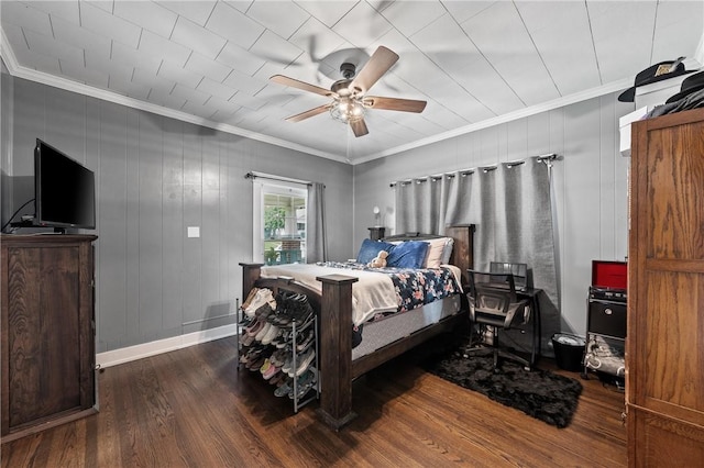 bedroom with wooden walls, dark hardwood / wood-style floors, ceiling fan, and crown molding