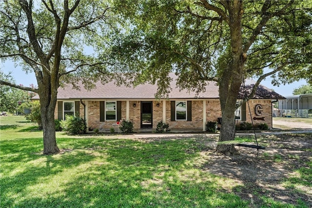 ranch-style house with a front lawn and a carport