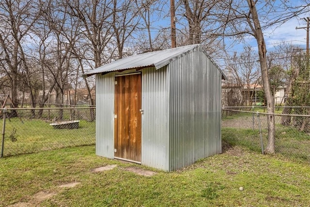 view of shed featuring a fenced backyard