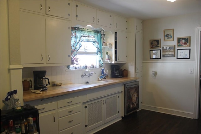 kitchen featuring dark hardwood / wood-style floors, butcher block countertops, tasteful backsplash, beverage cooler, and white cabinets