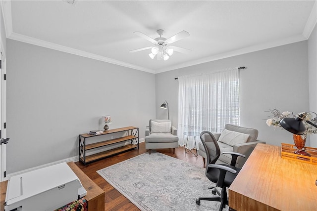 office space with a ceiling fan, baseboards, ornamental molding, and wood finished floors