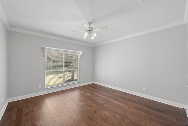 spare room with ceiling fan, crown molding, baseboards, and dark wood-type flooring