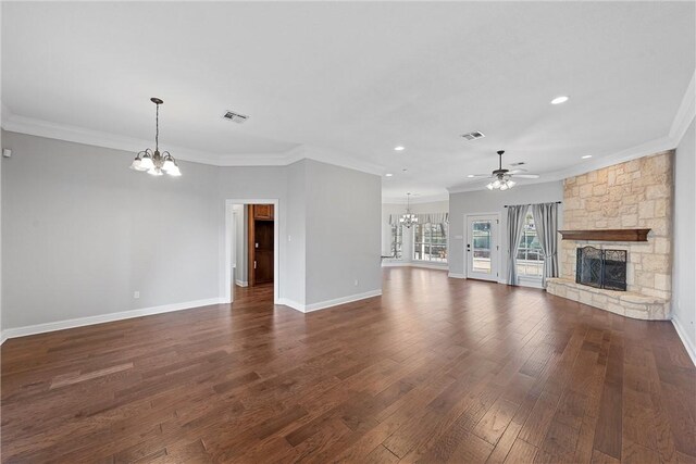 entrance foyer with hardwood / wood-style flooring, an inviting chandelier, plenty of natural light, and crown molding