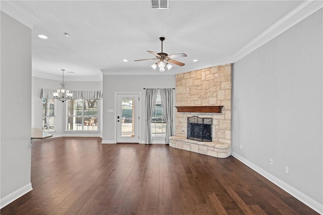 unfurnished living room with a fireplace, visible vents, ornamental molding, wood finished floors, and ceiling fan with notable chandelier