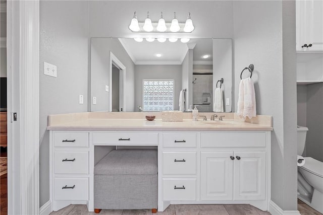 bathroom featuring crown molding, a shower stall, toilet, and vanity