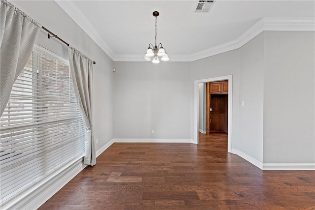 unfurnished room featuring visible vents, crown molding, baseboards, and wood finished floors