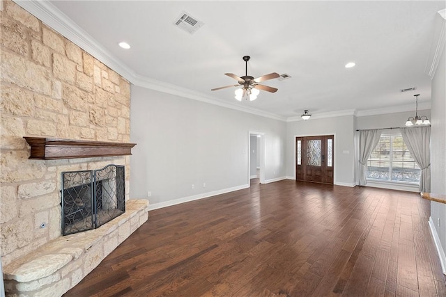 unfurnished living room with a fireplace, visible vents, baseboards, dark wood finished floors, and crown molding