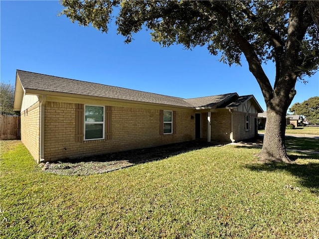 view of property exterior with a lawn