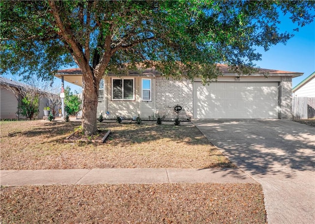 view of front of house with a garage and a front lawn