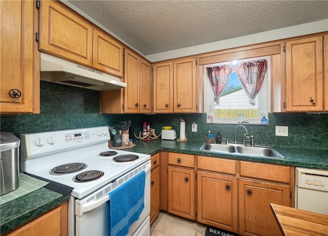 kitchen with decorative backsplash, a textured ceiling, white appliances, sink, and light tile patterned flooring