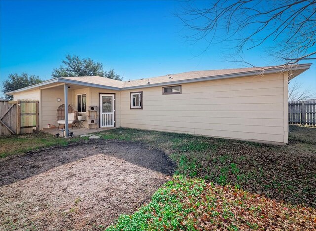 back of property featuring a patio area