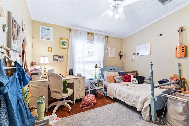 bedroom featuring ornamental molding, visible vents, dark wood finished floors, and a textured ceiling