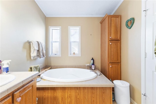 full bathroom with ornamental molding, a garden tub, and vanity