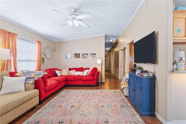 living area with dark wood-style floors, ceiling fan, a textured ceiling, and baseboards