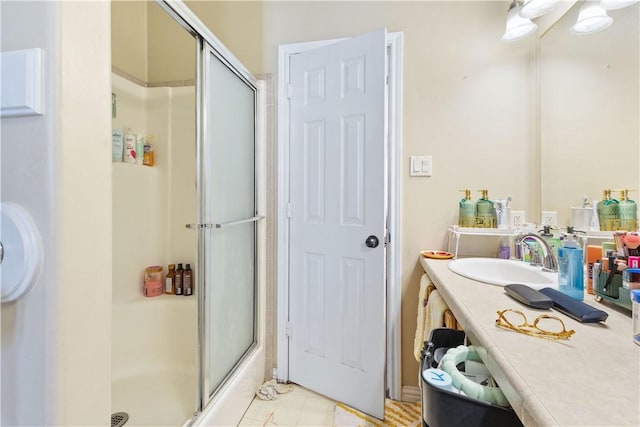 bathroom featuring vanity and a shower with shower door