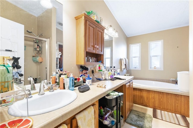 full bathroom featuring a garden tub, ornamental molding, a stall shower, vanity, and tile patterned floors