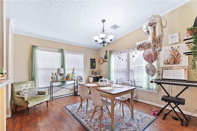 dining space featuring a textured ceiling, visible vents, vaulted ceiling, dark wood-style floors, and an inviting chandelier