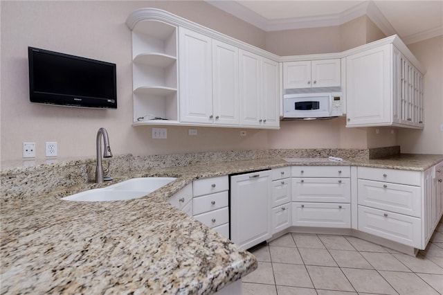 kitchen featuring sink, light stone counters, white appliances, white cabinets, and ornamental molding