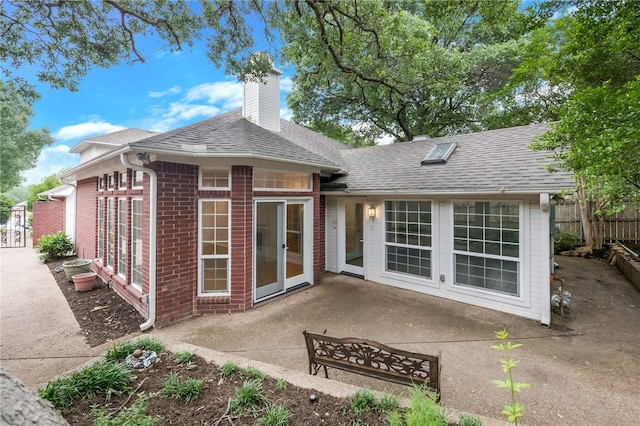 back of property featuring a patio