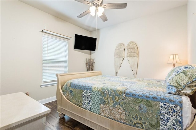 bedroom featuring a ceiling fan, dark wood-style flooring, and baseboards