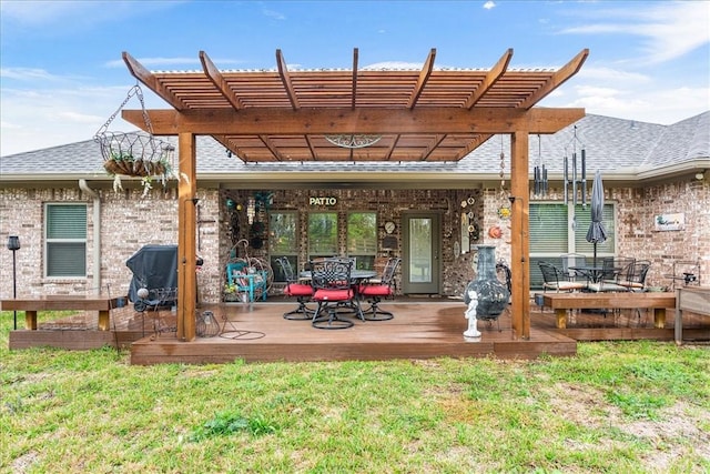 rear view of house featuring outdoor dining area, a deck, and a pergola