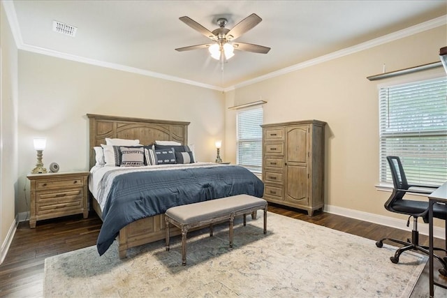 bedroom with multiple windows, dark wood-style flooring, visible vents, and baseboards