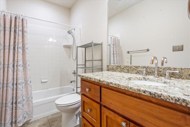 bathroom featuring toilet, shower / bath combo, vanity, and tile patterned floors