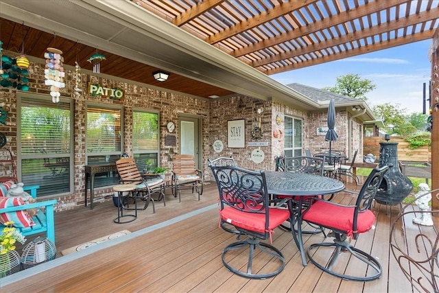 deck featuring outdoor dining area and a pergola