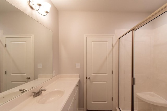 bathroom with vanity and walk in shower