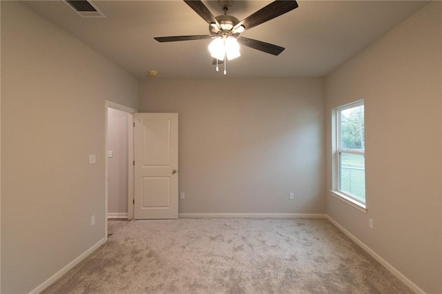 carpeted empty room with ceiling fan